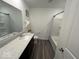 Well-lit bathroom featuring a large mirror, single vanity, and a shower-tub combination at 1573 Vera Blvd, Danville, IN 46122