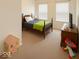 Warm and inviting bedroom with a charming bed, soft carpet, and a dollhouse, perfect for a comfort at 1573 Vera Blvd, Danville, IN 46122