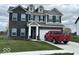 Beautiful two-story home featuring brick and vinyl siding, well-kept lawn, and convenient two-car garage at 1573 Vera Blvd, Danville, IN 46122
