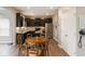 Eat-in kitchen features dark cabinets, stainless appliances and modern lighting at 1573 Vera Blvd, Danville, IN 46122