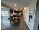 Open concept kitchen, connected to an office and dining area, with stainless steel appliances and an island at 1573 Vera Blvd, Danville, IN 46122