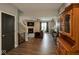 Open floor plan with fireplace, TV, and hardwood floors, bright open concept at 1573 Vera Blvd, Danville, IN 46122