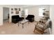 Cozy living room with two black couches, a glass coffee table, natural light, and wall decor at 1573 Vera Blvd, Danville, IN 46122