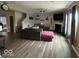 Comfortable living room with a fireplace, hardwood floors, ceiling fan, and natural light at 1573 Vera Blvd, Danville, IN 46122