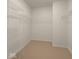 Functional walk-in closet with ample shelving and storage space for organizing clothes and accessories at 1573 Vera Blvd, Danville, IN 46122