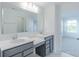 Bathroom featuring dual sinks, gray cabinets, vanity, and marble tile flooring at 15970 Meadow Frost Ct, Fishers, IN 46037