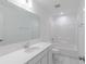 Bathroom featuring modern fixtures, a large mirror, and a clean, white aesthetic at 15970 Meadow Frost Ct, Fishers, IN 46037