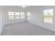Spacious bedroom bathed in natural light from large windows with neutral carpet at 15970 Meadow Frost Ct, Fishers, IN 46037