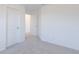 Image of a bedroom with soft carpeting and white walls, leading to an open doorway at 15970 Meadow Frost Ct, Fishers, IN 46037