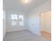 Clean, carpeted bedroom features two windows and a door looking into the hallway at 15970 Meadow Frost Ct, Fishers, IN 46037