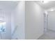 Bright hallway with staircase and bedrooms featuring neutral paint and soft carpet at 15970 Meadow Frost Ct, Fishers, IN 46037