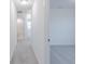 Hallway featuring neutral paint and soft carpet, leading to a bathroom and bedrooms at 15970 Meadow Frost Ct, Fishers, IN 46037