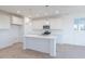 Modern kitchen with white cabinetry, stainless steel appliances, and a center island with a sink at 15970 Meadow Frost Ct, Fishers, IN 46037