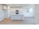 Modern kitchen with white cabinets, stainless steel appliances, and an island with pendant lighting at 15970 Meadow Frost Ct, Fishers, IN 46037