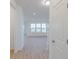 Open living space with lots of natural light and wood flooring at 15970 Meadow Frost Ct, Fishers, IN 46037