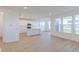 Open-concept living area with a view of the bright kitchen and dining area featuring ample natural light at 15970 Meadow Frost Ct, Fishers, IN 46037