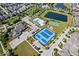 Aerial shot highlights community amenities like tennis, pools, and a play area amidst neighborhood homes at 1614 Waterleaf Dr, Westfield, IN 46074