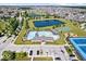 Aerial view of a community recreational area including swimming pools, ponds, and sports facilities at 1614 Waterleaf Dr, Westfield, IN 46074