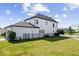 Exterior view of a modern two-story home with a well-maintained yard, black fence, and lush landscaping at 1614 Waterleaf Dr, Westfield, IN 46074