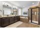 Elegant bathroom with double vanity, soaking tub, and glass-enclosed shower with tiled walls at 1614 Waterleaf Dr, Westfield, IN 46074