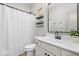 Well-lit bathroom with a walk-in shower, toilet, and a vanity with modern fixtures and decor at 1614 Waterleaf Dr, Westfield, IN 46074