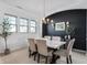 Elegant dining room features a marble table, modern chandelier, and stylish black accent wall at 1614 Waterleaf Dr, Westfield, IN 46074