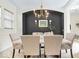 Elegant dining room with modern chandelier and dark accent wall is perfect for entertaining guests at 1614 Waterleaf Dr, Westfield, IN 46074
