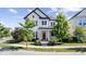 Charming two-story home featuring a welcoming porch and a beautifully landscaped front yard at 1614 Waterleaf Dr, Westfield, IN 46074
