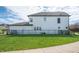 Exterior view of two-story home with white siding and dark trim, showing a well-kept lawn and black fencing at 1614 Waterleaf Dr, Westfield, IN 46074