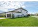 View of a two-story home featuring a well-manicured lawn and dark-colored garage door with black fence at 1614 Waterleaf Dr, Westfield, IN 46074