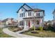 Stylish two-story home with white siding and manicured front yard and walkway at 1614 Waterleaf Dr, Westfield, IN 46074