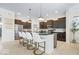 Modern kitchen with granite countertops, stainless steel appliances, and island seating at 1614 Waterleaf Dr, Westfield, IN 46074