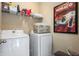 Functional laundry room equipped with modern appliances and ample storage space at 1614 Waterleaf Dr, Westfield, IN 46074