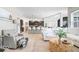 Bright, open-concept living room featuring modern decor, hardwood floors, and seamlessly connects to the kitchen at 1614 Waterleaf Dr, Westfield, IN 46074