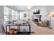 Cozy living room features a white sofa, fireplace, and modern decor at 1614 Waterleaf Dr, Westfield, IN 46074