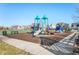 Community playground with a variety of equipment, benches, and a basketball court nearby at 1614 Waterleaf Dr, Westfield, IN 46074