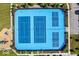 Aerial view of four blue outdoor tennis courts surrounded by green landscaping and parking area at 1614 Waterleaf Dr, Westfield, IN 46074