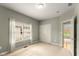 Bedroom with window, closet, and a door leading to an adjoining room with hardwood floors at 16350 Quartz Dr, Noblesville, IN 46060