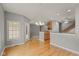 Open-concept dining room with hardwood floors and a view of the staircase, open to other rooms at 16350 Quartz Dr, Noblesville, IN 46060