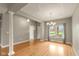 Elegant dining area with wood floors, decorative ceiling, chandelier, and bright natural light at 16350 Quartz Dr, Noblesville, IN 46060