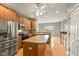 Modern kitchen featuring stainless steel appliances, wood cabinets, and a center island at 16350 Quartz Dr, Noblesville, IN 46060