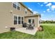 Inviting backyard patio area with outdoor seating, grill, and well-maintained lawn at 16758 Bingham Dr, Westfield, IN 46074