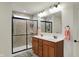Modern bathroom featuring a walk-in shower with tile and a double sink vanity at 16758 Bingham Dr, Westfield, IN 46074