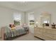 Bright bedroom with a soft-pink bed frame and a dresser in front of two sunny windows at 16758 Bingham Dr, Westfield, IN 46074