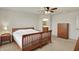 This cozy bedroom features carpet floors and a wooden bed frame at 16758 Bingham Dr, Westfield, IN 46074