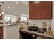 Bright home office featuring granite countertops that overlook the living room and backyard at 16758 Bingham Dr, Westfield, IN 46074