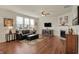 Comfortable living room featuring a fireplace, hardwood floors, and natural light at 16758 Bingham Dr, Westfield, IN 46074