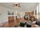 Spacious living area with hardwood floors that connects to dining and kitchen at 16758 Bingham Dr, Westfield, IN 46074