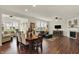Bright and spacious living room with a fireplace, large windows, and hardwood flooring at 16758 Bingham Dr, Westfield, IN 46074
