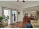 Inviting living room with sliding glass doors, hardwood floors, and adjacent dining area at 16758 Bingham Dr, Westfield, IN 46074